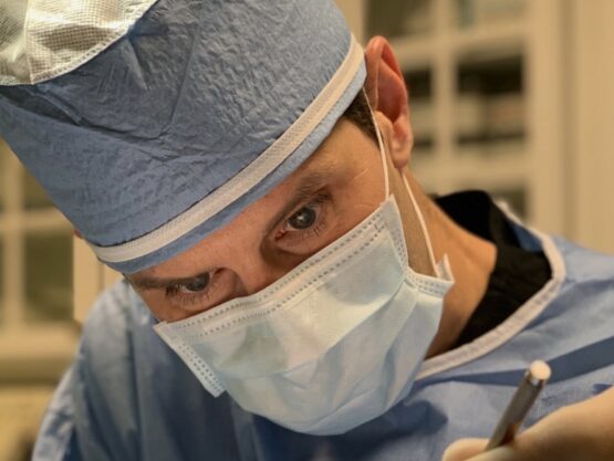 Dr. Ryan Marshall Operates with Experience Dr. Ryan Marshall working in a surgery with his team