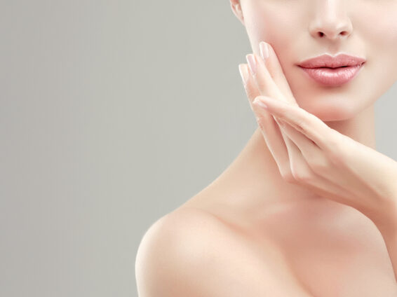 woman holding her chin after a facelift