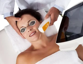 Woman undergoing hair removal procedure using nordlys skin lasers