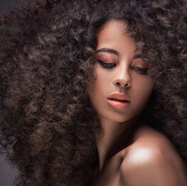 closeup of black woman with thick curly hair